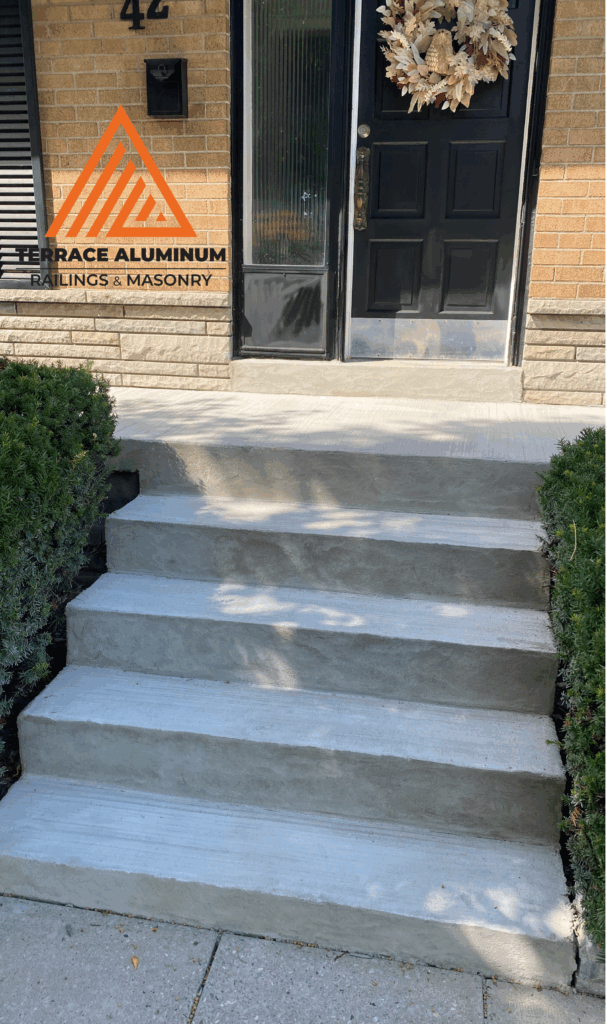 Concrete porch repair with aluminum railings in Etobicoke