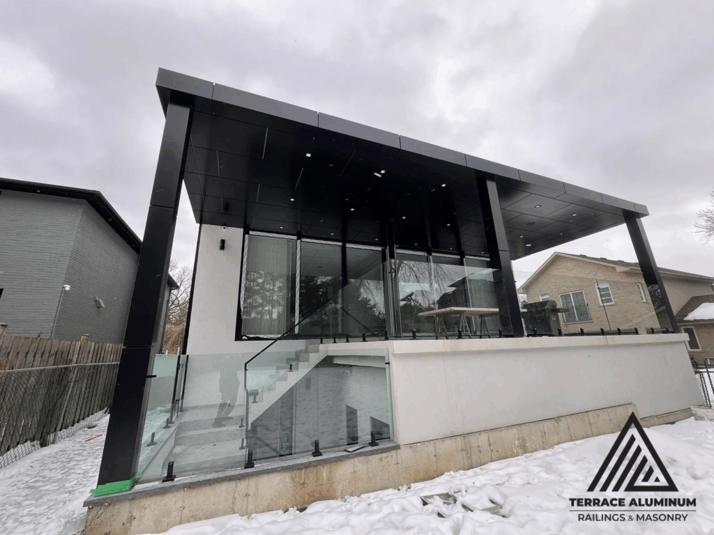 Frameless glass deck railing installed in Oakville with 12mm tempered glass panels and stainless steel hardware.