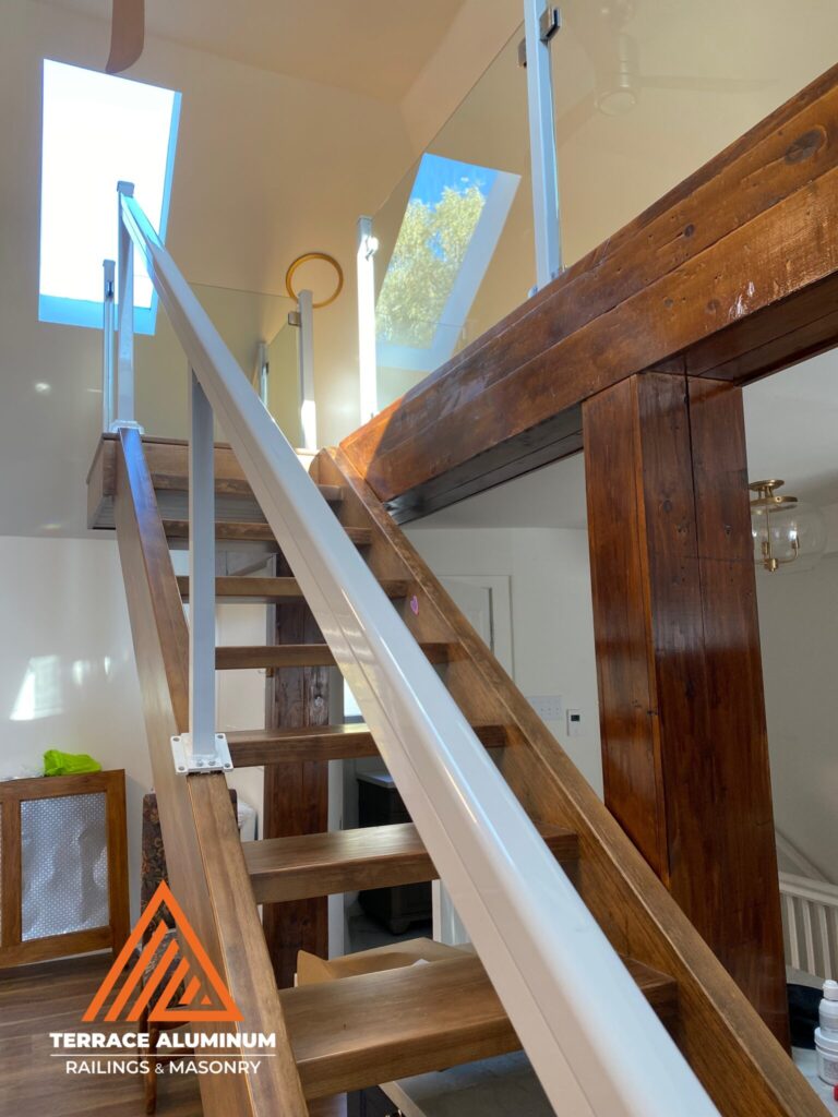 Interior topless glass railings installed in a modern Oakville home with 12mm tempered glass panels.