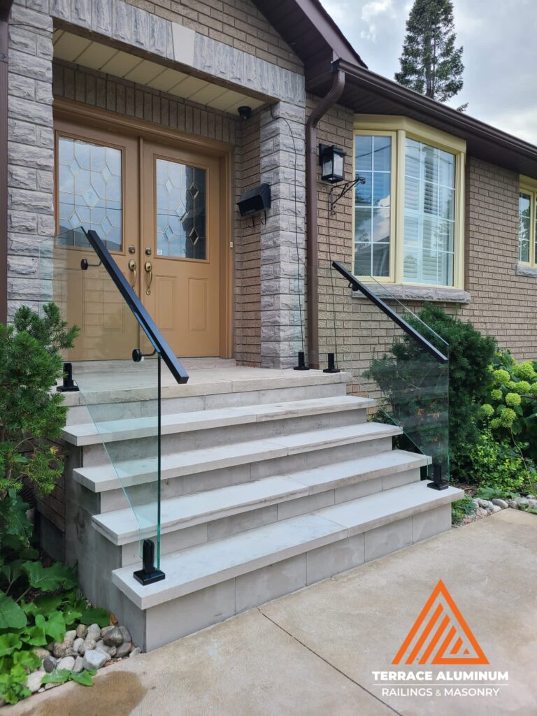 Exterior frameless glass railing in Oakville by Terrace Aluminum Railings & Masonry