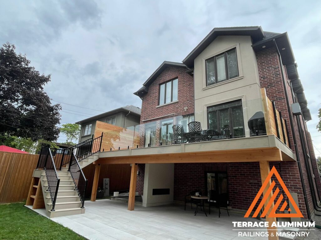 Are glass railings worth it? Frameless glass railings for a deck featuring clear tempered panels and modern minimalist outdoor design