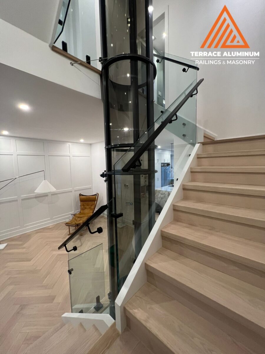 Interior glass railing with standoffs Oakville — frameless glass staircase railing by Terrace Aluminum Railings & Masonry