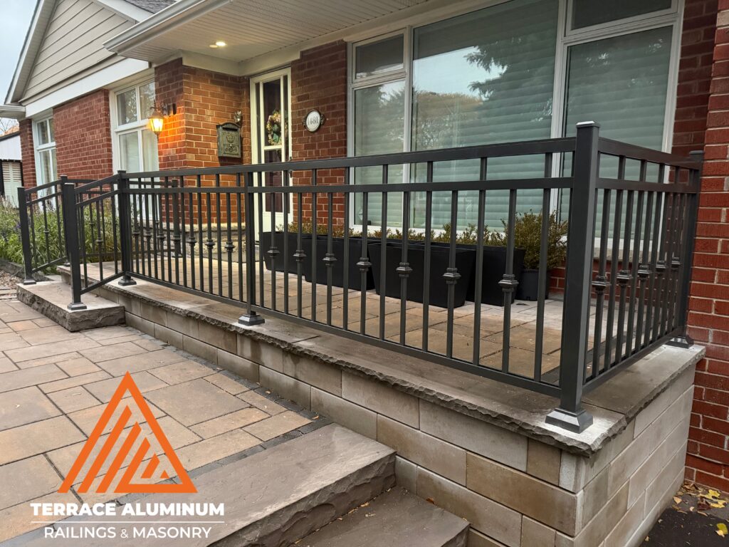 Decorative-style aluminum railing on a front porch in Toronto, featuring detailed design and solid construction from Terrace Aluminum Railings & Masonry, shown in the blog Are Aluminum Railings Sturdy?