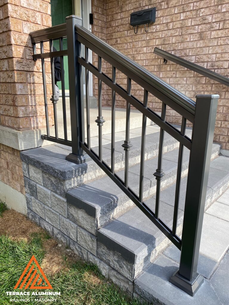 Brown aluminum railing installed on a front porch in Toronto, showing the clean design and long-lasting strength of aluminum railings featured in our blog Are Aluminum Railings Sturdy?