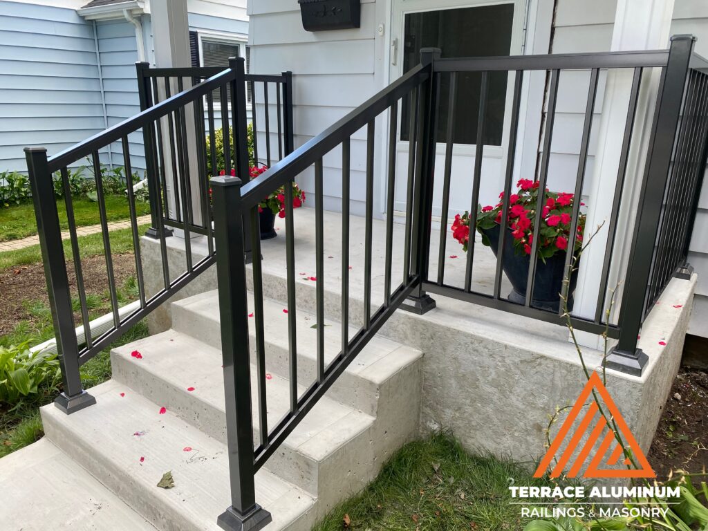 Aluminum railing installed on a front porch, enhancing curb appeal and the home’s exterior appearance
