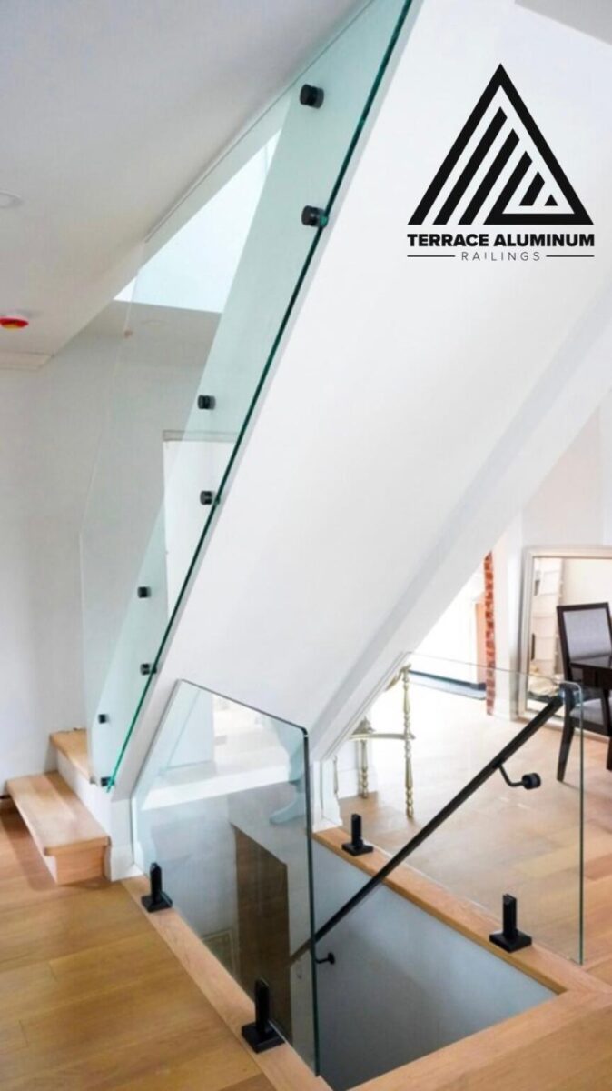 Interior staircase enclosed with frameless tempered glass railing