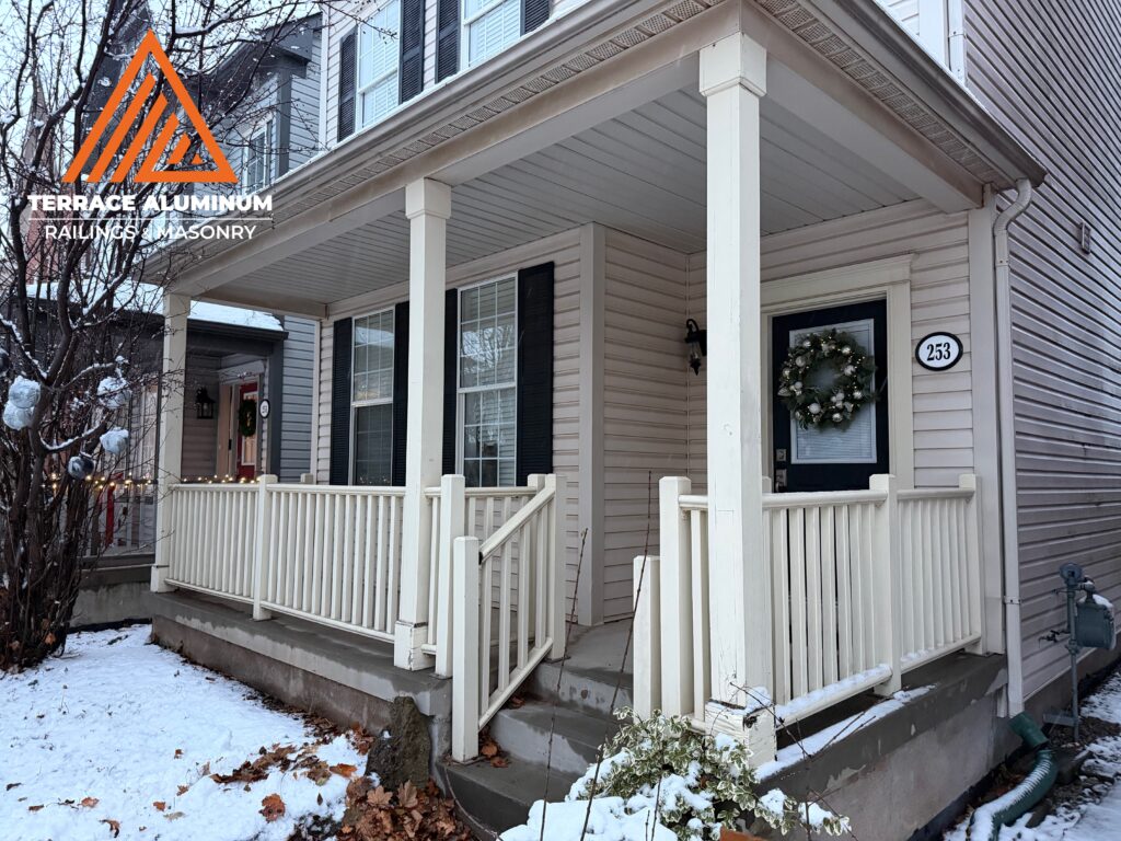 Before photo of a traditional wood porch railing and columns on a home in Oakville