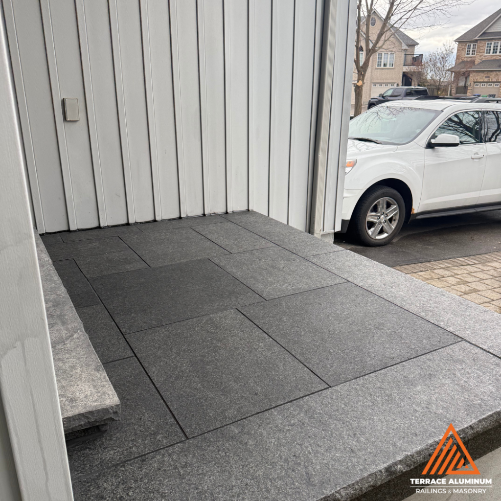 Flagstone repair Oakville featuring a new flagstone overlay on existing surface