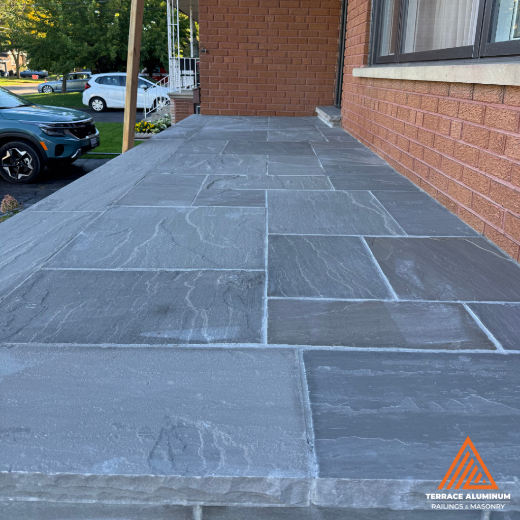 Flagstone repair with joint replacement and stone re-leveling