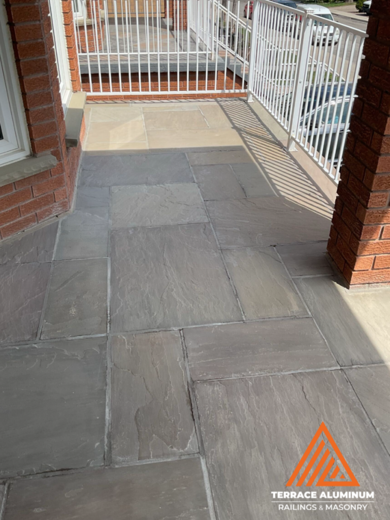 Flagstone repair Hamilton before front porch with loose and damaged stone