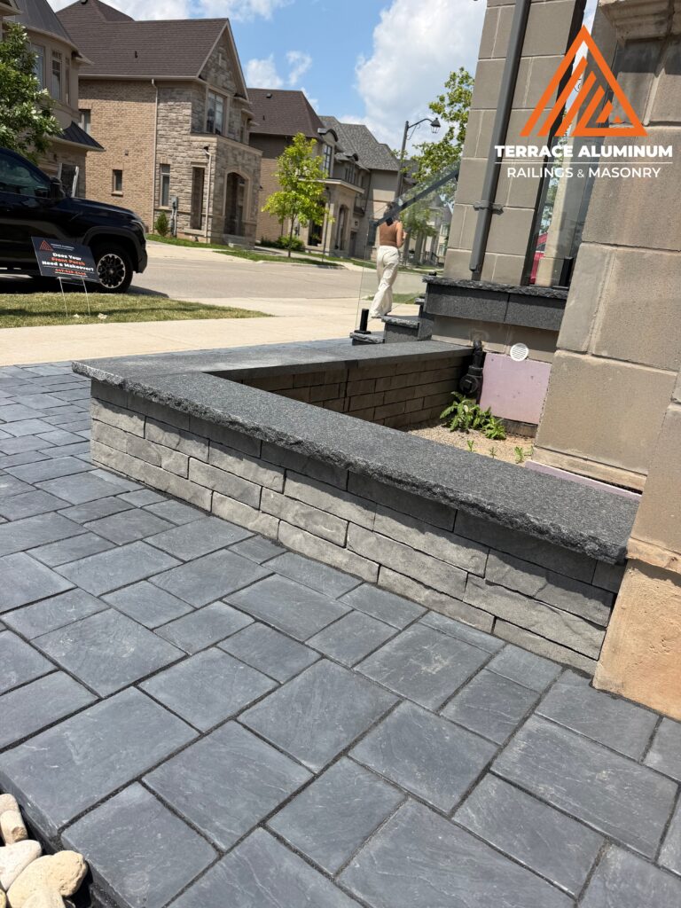 Interlock garden bed installed as part of a Hardscaping Oakville project