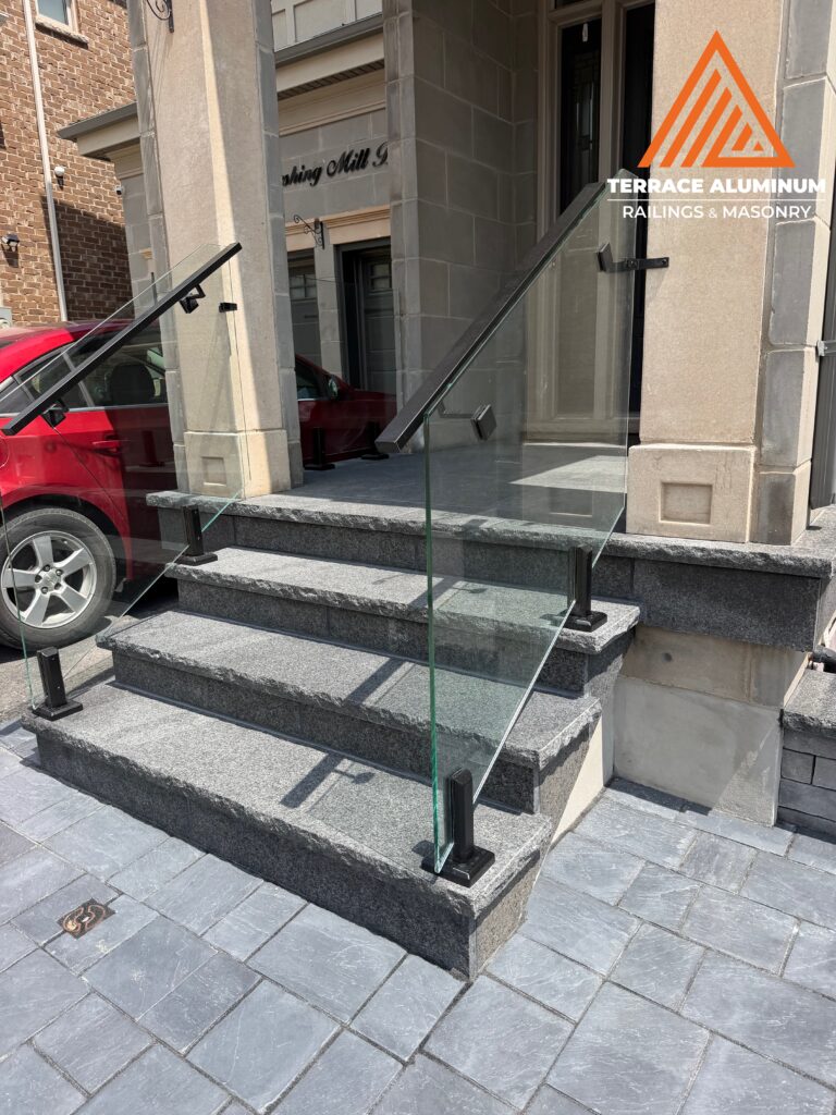Black Pearl flagstone front porch completed as part of a Hardscaping Oakville project