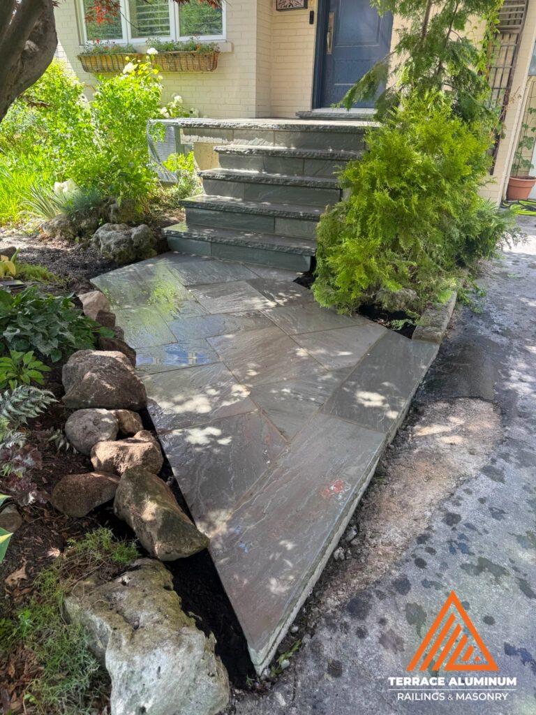 Slate Gray flagstone front porch and walkway installed as part of a Hardscaping Oakville project