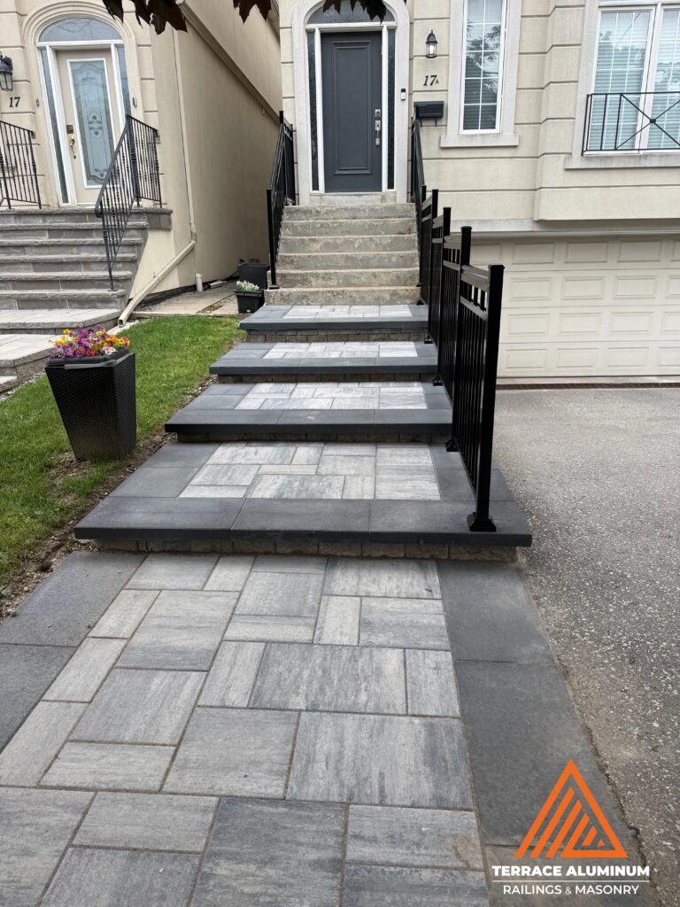 Interlocking paver steps leading to a front porch as part of a Hardscaping Oakville project