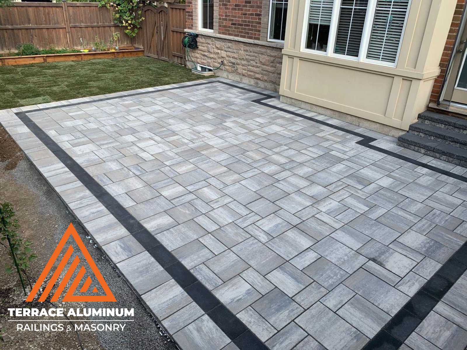 Backyard interlock patio completed as part of hardscaping services in Etobicoke.